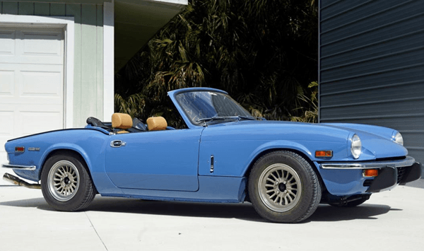 Which British sports car shared its name with a famous World War II fighter aircraft?