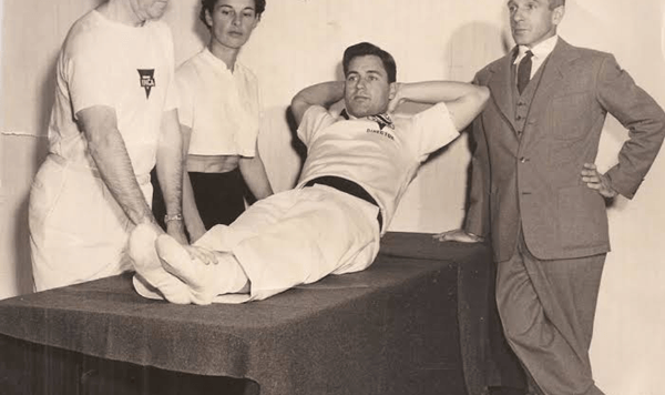 Which famous national physical fitness program evaluated students on pull-ups, shuttle runs, and the sit-and-reach from the 1950s all the way until 2013?