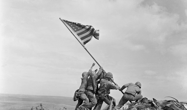 Which famous World War II battle is depicted in Joe Rosenthal's iconic photograph of Marines raising the flag on Mount Suribachi?