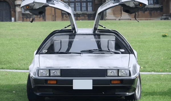 Which car became a pop-culture icon as a time machine, despite being notoriously slow in reality?