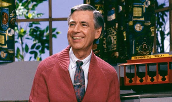 Which gentle children's series premiered in 1968, teaching kindness and empathy through puppetry, songs, and friendly neighborhood visits?