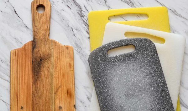 Does a wooden cutting board harbor more bacteria than a plastic cutting board?