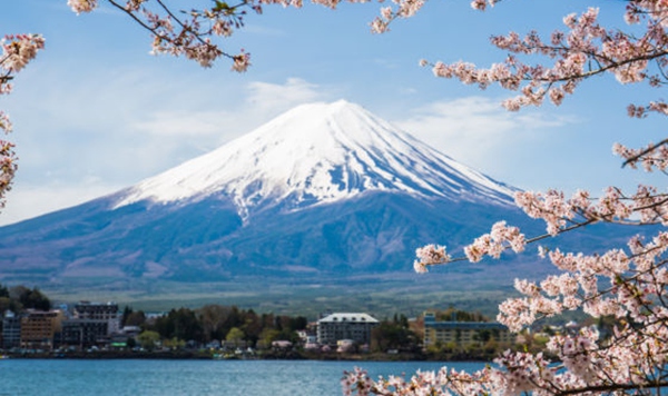 Standing at 3,776 meters (12,389 ft), what is Japan's highest and most sacred peak, visible from Tokyo on clear days?