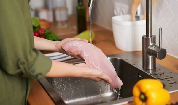 MYTH OR FACT: You should wash raw chicken under the kitchen faucet before cooking it to remove bacteria.