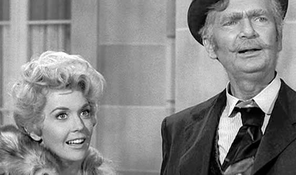 A Ozark mountaineer family struck crude oil while hunting and moved into a sprawling Beverly Hills mansion in which smash-hit sitcom?