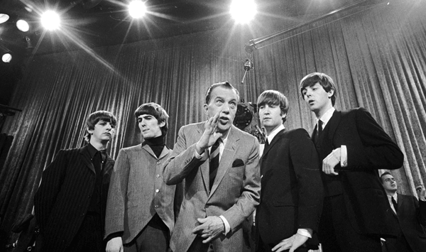 Which popular television variety show hosted The Beatles' landmark first live U.S. performance in February 1964?