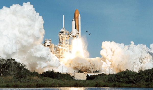 What was the name of NASA's very first reusable space shuttle, which launched on its inaugural orbital mission in April 1981?