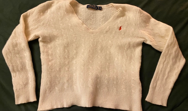 If a favorite 100% wool sweater accidentally shrinks in the wash, what bathroom product can help relax the fibers so you can stretch it back to size?