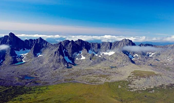 Which immense mountain range has long been considered the traditional boundary separating Europe from Asia?