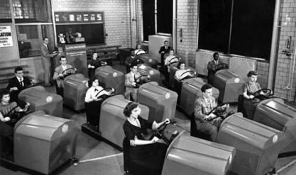 What driver training device did students practice on in the classroom before hitting the real road?