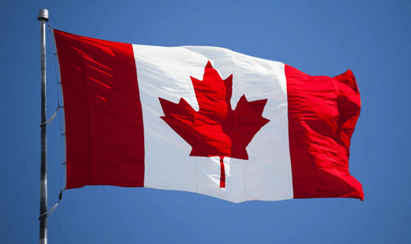 Which country's flag is red and white with a red maple leaf in the center?