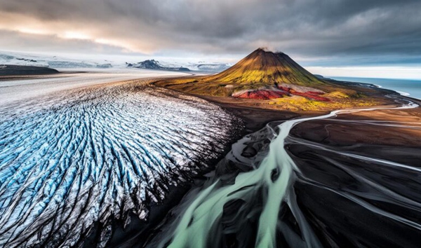 Which European island nation sits directly on the Mid-Atlantic Ridge, making it a hotspot for geysers, hot springs, and active volcanoes?