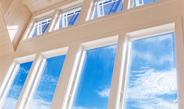 Instead of paper towels, what classic item was famously used to wipe down glass windows for a streak-free, lint-free shine?