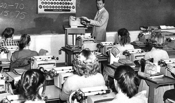 Which mechanical machine did students use in typing class before computers existed?