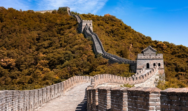Stretching over 13,000 miles (21,000 km) in total length, what is the name of this historic defensive barrier built over centuries to protect against northern invasions?