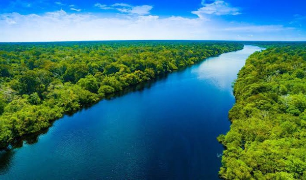 Flowing through South America, which river discharges the greatest volume of water into the sea-more than the next seven largest rivers combined?