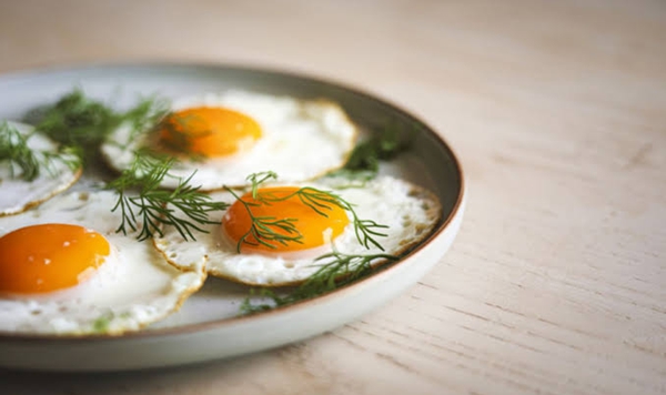 TRUE OR FALSE: For most people, eating eggs has little to no impact on blood cholesterol levels.