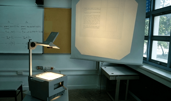 Which vintage presentation equipment is set up in this classroom?