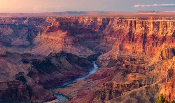 Formed primarily by the erosion of the Colorado River over millions of years, which natural wonder stretches 277 miles (446 km) long and up to 18 miles (29 km) wide?