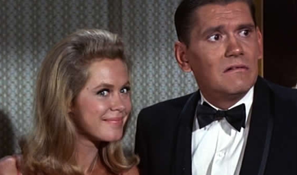 Which classic fantasy sitcom featured a suburban housewife whose magical powers were activated by a famous, subtle twitch of her nose?